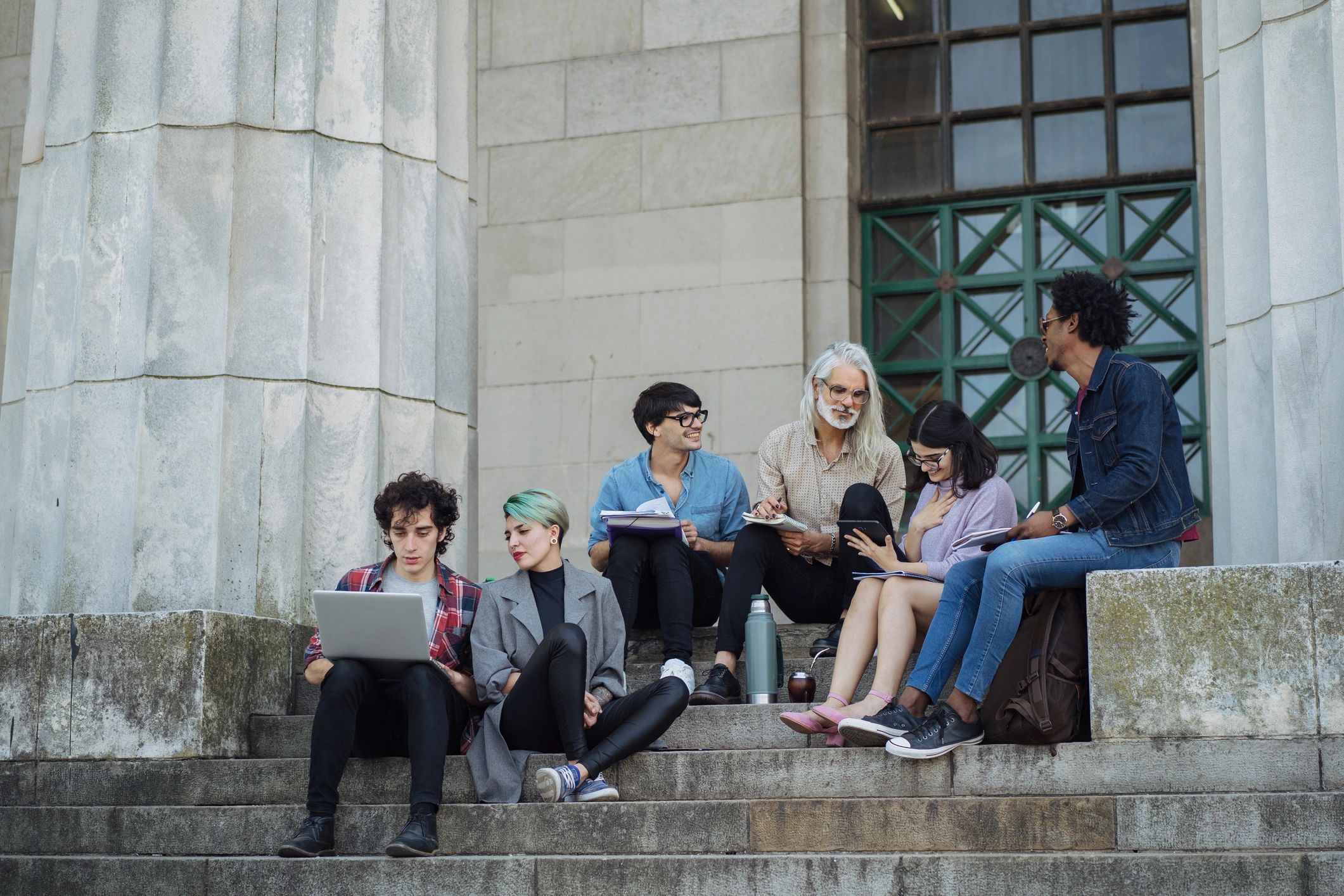 Students learning together with an instructor outdoors