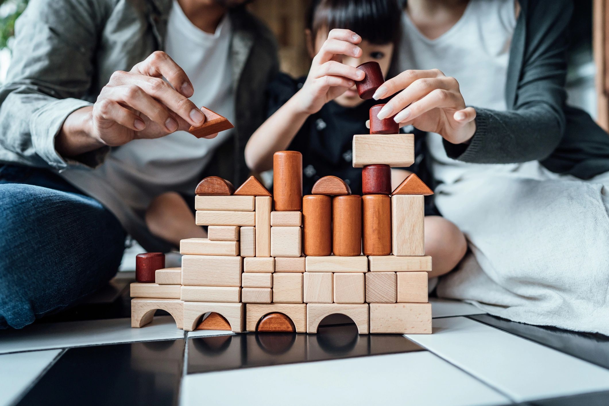 Family playing with educational building blocks
