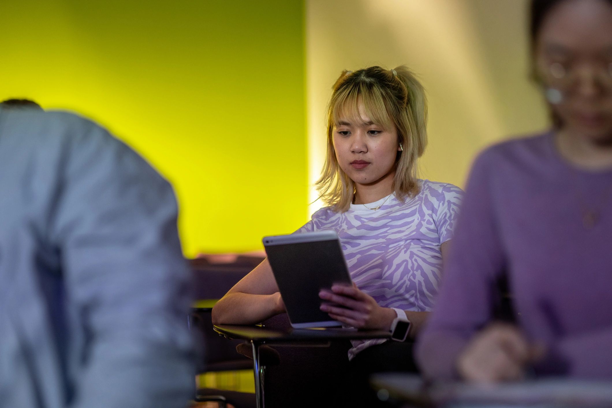 Learner taking notes during a training session
