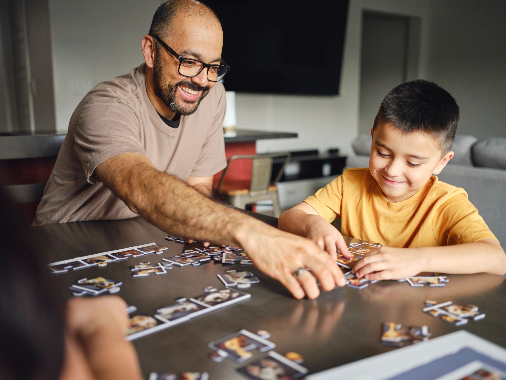 Family working together on a jigsaw puzzle